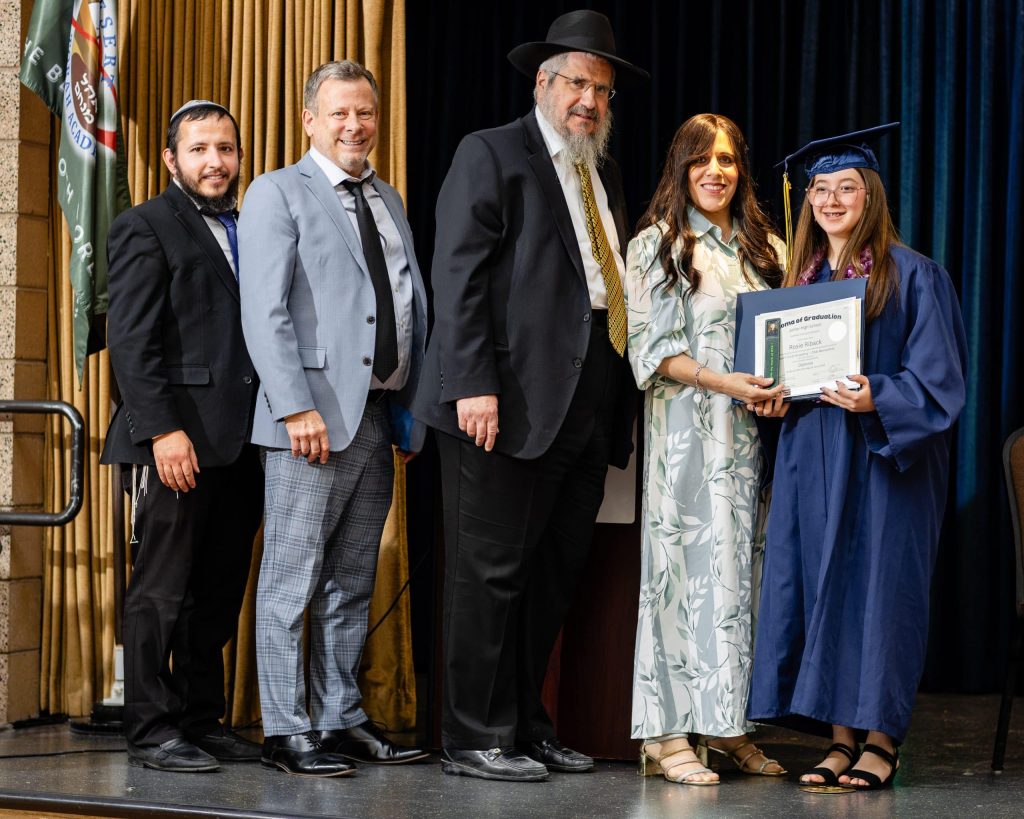Desert Torah Academy graduate receiving her diploma