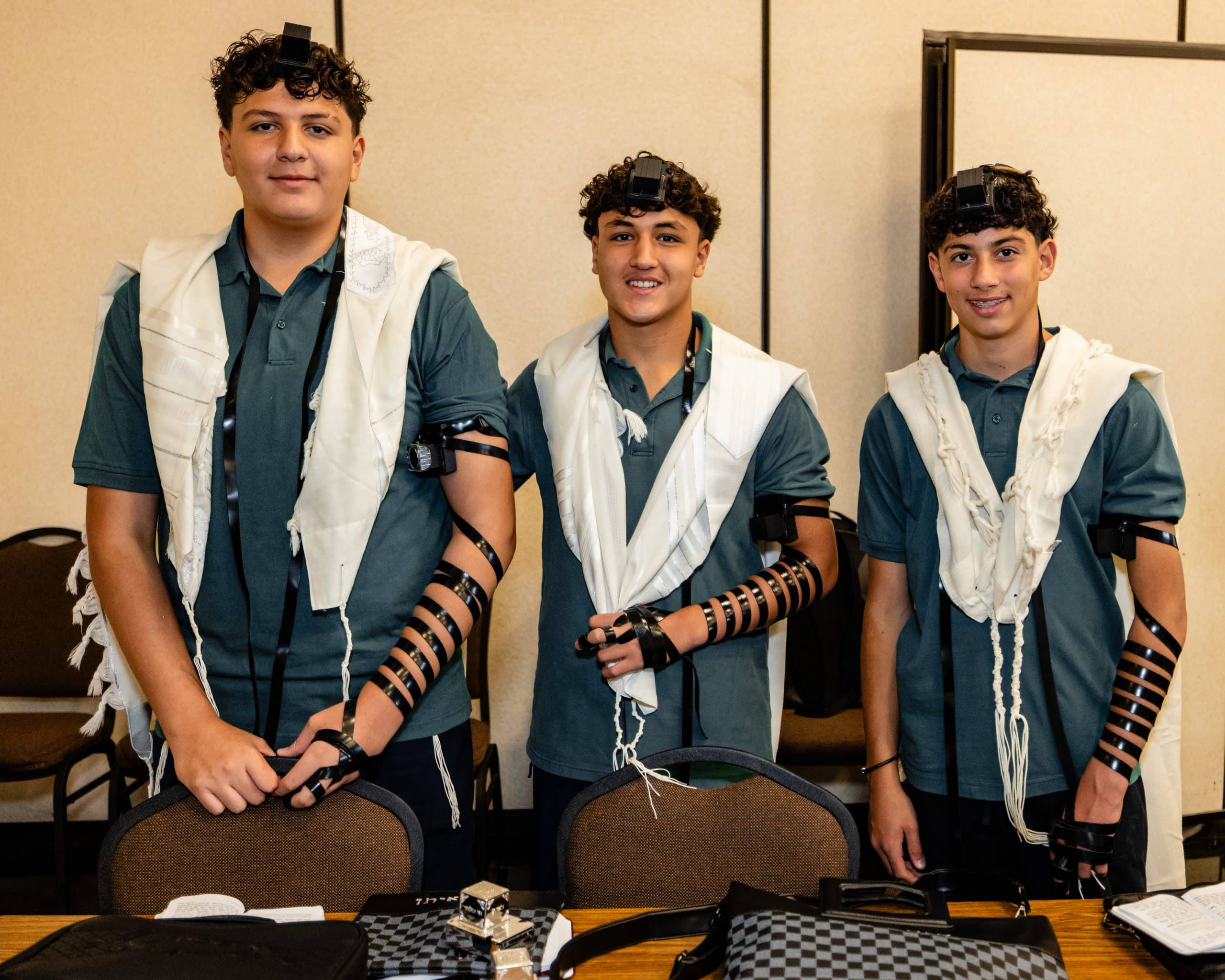 Students wearing tallis and tefillin